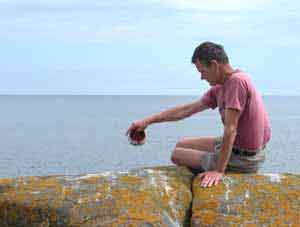 Robert scattering the ashes